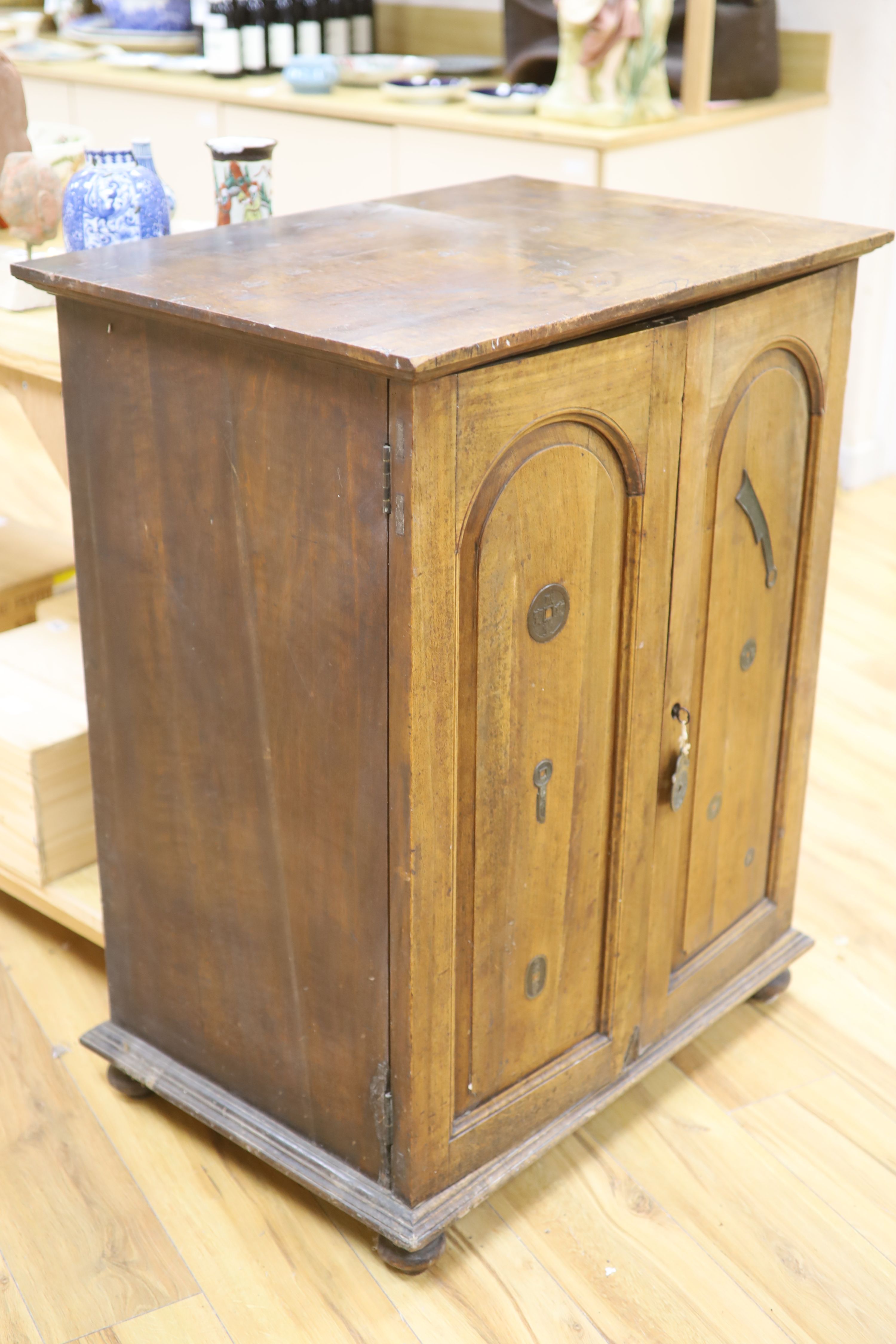 A walnut collectors cabinet for Chinese and Asian amulets and coins, early 20th century,